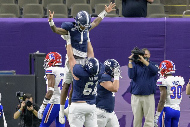 Georgia Southern quarterback Shai Werts (1) is lifted up after scoring a touchdown against Louisiana Tech during the first half of the New Orleans Bowl NCAA college football game in New Orleans, Wednesday, Dec. 23, 2020. (AP Photo/Matthew Hinton) Georgia Southern quarterback Shai Werts (1) is lifted up after scoring a touchdown against Louisiana Tech during the first half of the New Orleans Bowl NCAA college football game in New Orleans, Wednesday, Dec. 23, 2020. (AP Photo/Matthew Hinton)