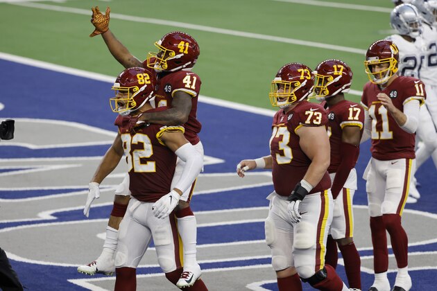Washington Football Team's Logan Thomas (82) and J.D. McKissic (41) celebrate McKissic's touchdown as Chase Roullier (73), Terry McLaurin (17) and Alex Smith (11) look on during the first half of the team's NFL football game against the Dallas Cowboys in Arlington, Texas, Thursday, Nov. 26, 2020. (AP Photo/Ron Jenkins)