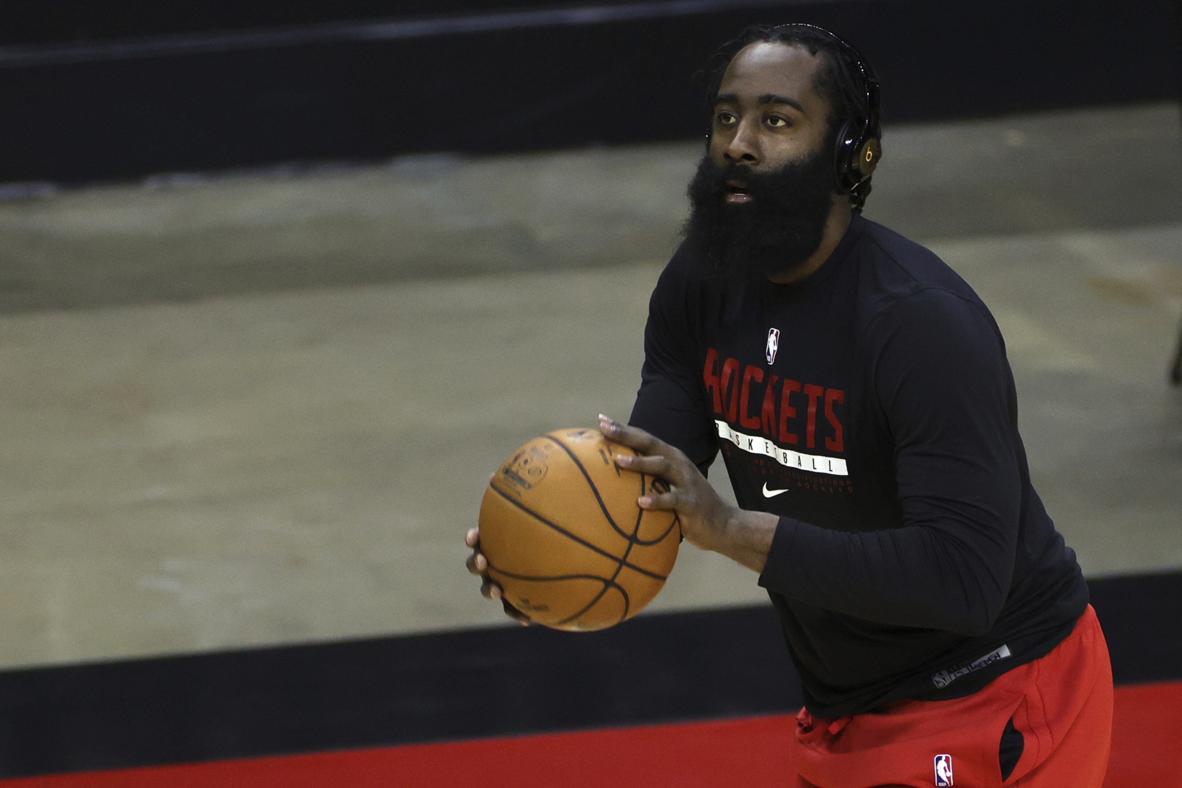 Houston Rockets' James Harden warms up prior to facing the San Antonio Spurs in an NBA basketball game in Houston, Thursday, Dec. 17, 2020. (Carmen Mandato/Pool Photo via AP)