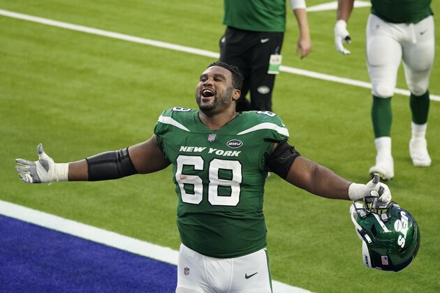 New York Jets offensive guard Josh Andrews (68) celebrates after a win over the Los Angeles Rams during an NFL football game Sunday, Dec. 20, 2020, in Inglewood, Calif. (AP Photo/Ashley Landis) New York Jets offensive guard Josh Andrews (68) celebrates after a win over the Los Angeles Rams during an NFL football game Sunday, Dec. 20, 2020, in Inglewood, Calif. (AP Photo/Ashley Landis)
