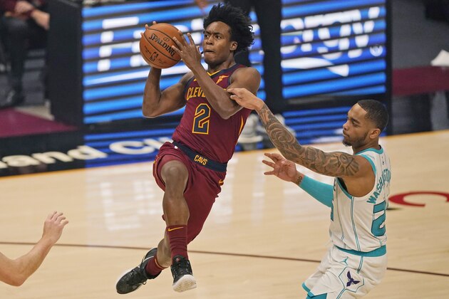 Cleveland Cavaliers' Collin Sexton (2) drives to the basket, and is fouled by Charlotte Hornets' P.J. Washington (25) during the first half of an NBA basketball game Wednesday, Dec. 23, 2020, in Cleveland. (AP Photo/Tony Dejak) Cleveland Cavaliers' Collin Sexton (2) drives to the basket, and is fouled by Charlotte Hornets' P.J. Washington (25) during the first half of an NBA basketball game Wednesday, Dec. 23, 2020, in Cleveland. (AP Photo/Tony Dejak)