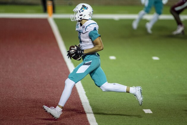 Coastal Carolina wide receiver Jaivon Heiligh (6) scores the go-ahead touchdown with less than a minute to play against Troy during the second half of an NCAA college football game, Saturday, Dec. 12, 2020, in Troy, Ala. (AP Photo/Vasha Hunt)