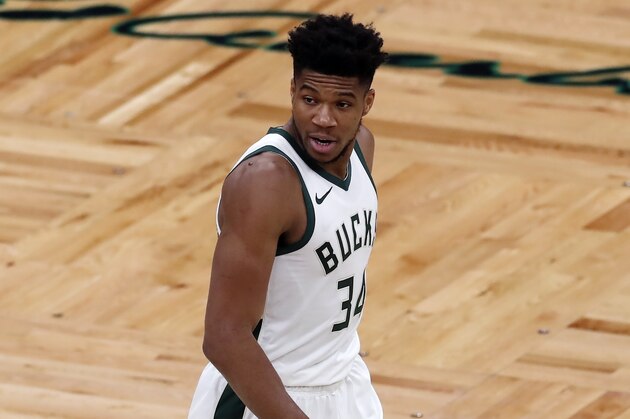 Milwaukee Bucks' Giannis Antetokounmpo plays against the Boston Celtics during the first half of an NBA basketball game, Wednesday, Dec. 23, 2020, in Boston. (AP Photo/Michael Dwyer)