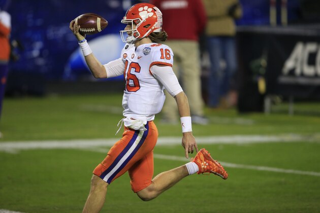 Clemson quarterback Trevor Lawrence (16) runs in for a touchdown during the second half of the Atlantic Coast Conference championship NCAA college football game against Notre Dame , Saturday, Dec. 19, 2020, in Charlotte, N.C. (AP Photo/Brian Blanco)
