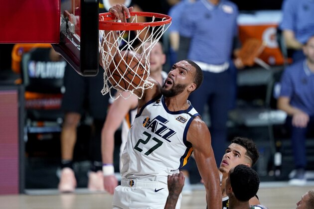 Utah Jazz's Rudy Gobert (27) dunks against the Denver Nuggets during the first half of an NBA basketball first round playoff game, Monday, Aug. 3, 2020, in Lake Buena Vista, Fla.(AP Photo/Ashley Landis, Pool)