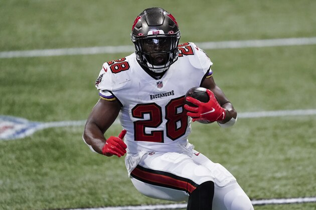 Tampa Bay Buccaneers running back Leonard Fournette (28) runs against the Atlanta Falcons during the second half of an NFL football game, Sunday, Dec. 20, 2020, in Atlanta. (AP Photo/John Bazemore)