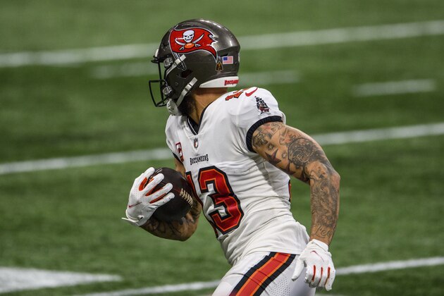 Tampa Bay Buccaneers wide receiver Mike Evans (13) runs the ball during the second half of an NFL football game against the Atlanta Falcons, Sunday, Dec. 20, 2020, in Atlanta. The Tampa Bay Buccaneers won 31-27. (AP Photo/Danny Karnik)