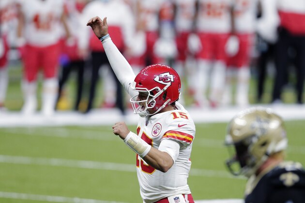 Kansas City Chiefs quarterback Patrick Mahomes (15) reacts after a touchdown by running back Le'Veon Bell in the second half of an NFL football game against the New Orleans Saints in New Orleans, Sunday, Dec. 20, 2020. (AP Photo/Brett Duke)