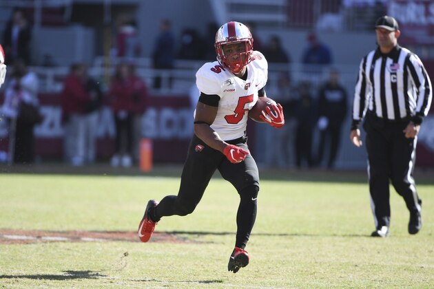 Western Kentucky running back Gaej Walker runs the ball against Arkansas during an NCAA college football game, Saturday, Nov. 9, 2019 in Fayetteville, Ark. (AP Photo/Michael Woods)