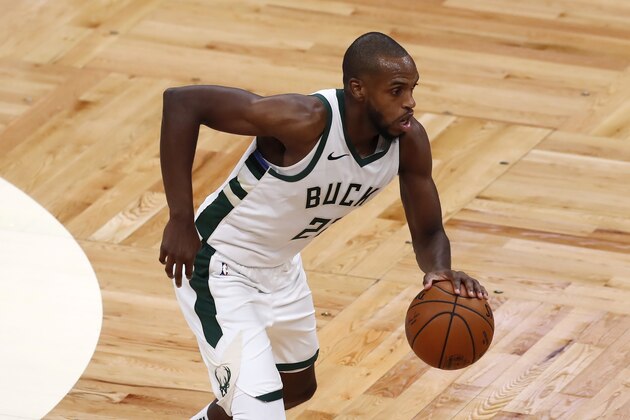 Milwaukee Bucks' Khris Middleton plays against the Boston Celtics during the second half of an NBA basketball game, Wednesday, Dec. 23, 2020, in Boston. (AP Photo/Michael Dwyer)