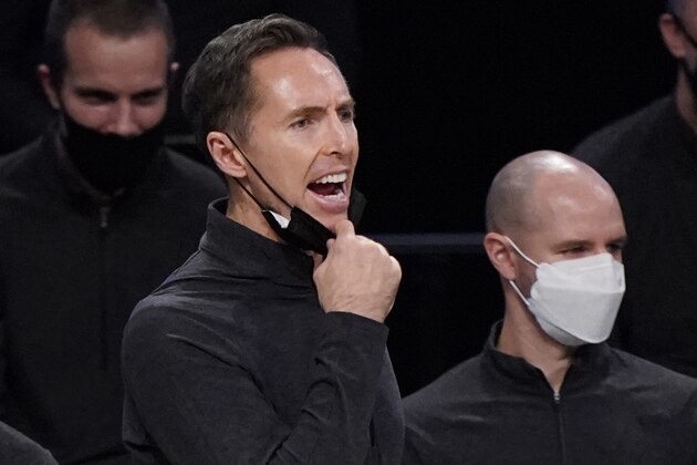 Brooklyn Nets head coach Steve Nash pulls his face mask down as he shouts during the second half of a preseason NBA basketball game against the Washington Wizards, Sunday, Dec. 13, 2020, in New York. (AP Photo/Kathy Willens)