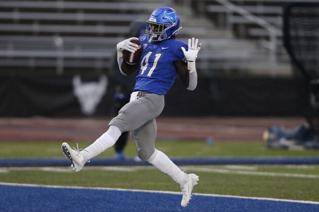 Buffalo's  Kevin Marks Jr. scores a touchdown during the first half of an NCAA college football game against Akron in Amherst, N.Y., Saturday, Dec. 12, 2020. (AP Photo/Jeffrey T. Barnes)