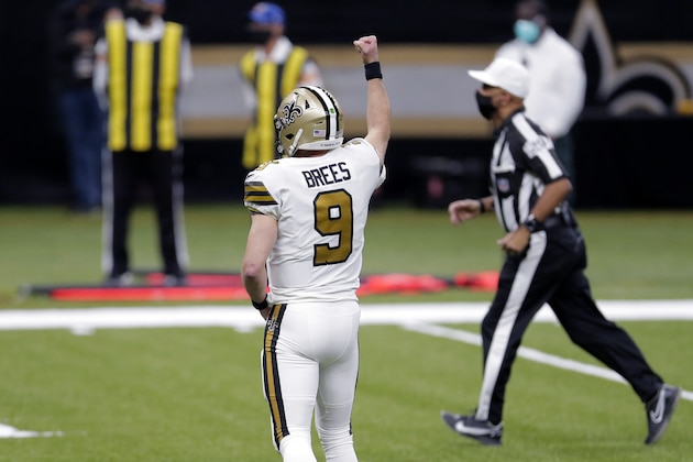 New Orleans Saints quarterback Drew Brees (9) celebrates a touchdown by running back Alvin Kamara in the first half of an NFL football game against the Minnesota Vikings in New Orleans, Friday, Dec. 25, 2020. (AP Photo/Brett Duke)