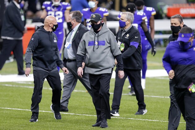 Minnesota Vikings head coach Mike Zimmer walks off the filed at the end of the first half of an NFL football game against the New Orleans Saints in New Orleans, Friday, Dec. 25, 2020. (AP Photo/Brett Duke)