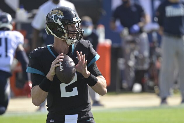 Jacksonville Jaguars quarterback Mike Glennon (2) looks for a receiver against the Tennessee Titans during the first half of an NFL football game, Sunday, Dec. 13, 2020, in Jacksonville, Fla. (AP Photo/Phelan M. Ebenhack)