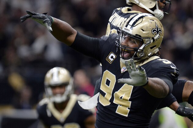 FILE - In this Jan. 7, 2018, file photo, New Orleans Saints defensive end Cameron Jordan (94) celebrates a defensive stop in the second half of an NFL football game against the Carolina Panthers, in New Orleans. Newly named All-Pro for the first time, Saints defensive Cam Jordan takes his playful yet menacing presence this weekend to the city where his father became a Pro Bowl tight end.  (AP Photo/Bill Feig, File)