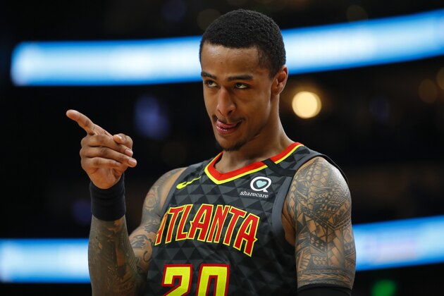 Atlanta Hawks forward John Collins (20) reacts in the second overtime of an NBA basketball game against the New York Knicks on Sunday, Feb. 9, 2020, in Atlanta. (AP Photo/Todd Kirkland)