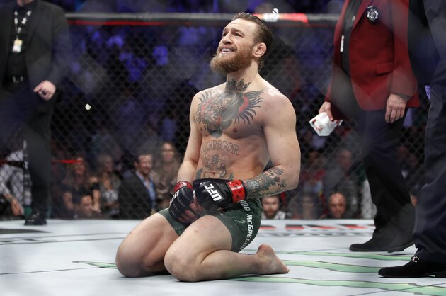 Conor McGregor smiles after defeating Donald