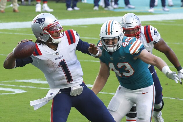 New England Patriots quarterback Cam Newton (1) aims a pass as Miami Dolphins outside linebacker Andrew Van Ginkel (43) attempts to defend, during the second half of an NFL football game against the Miami Dolphins, Sunday, Dec. 20, 2020, in Miami Gardens, Fla. (AP Photo/Joel Auerbach)