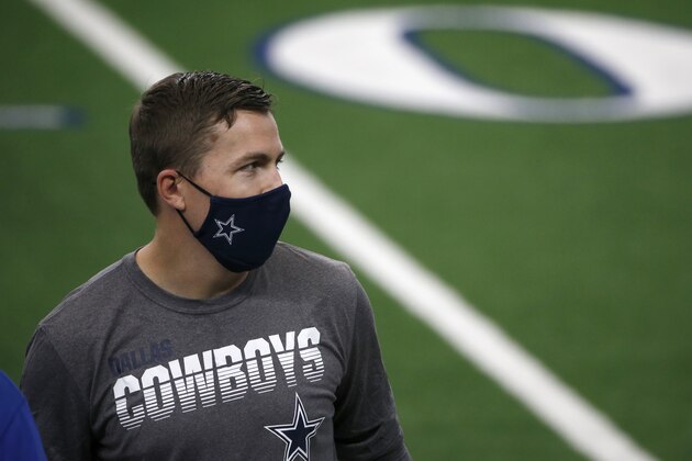 Dallas Cowboys offensive coordinator Kellen Moore stands of the field before an NFL football game against the New York Giants in Arlington, Texas, Sunday, Oct. 11, 2020. (AP Photo/Michael Ainsworth)