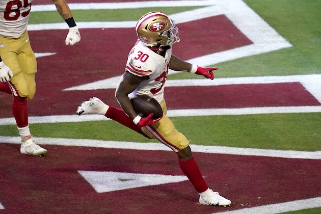 San Francisco 49ers running back Jeff Wilson (30) scores a touchdown against the Arizona Cardinals during the first half of an NFL football game, Saturday, Dec. 26, 2020, in Glendale, Ariz. (AP Photo/Ross D. Franklin)