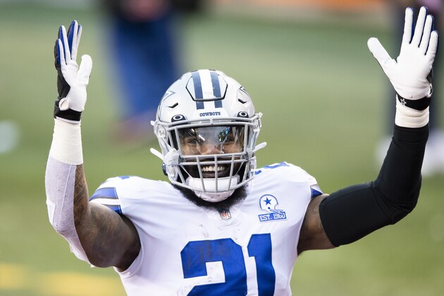 Dallas Cowboys running back Ezekiel Elliott (21) reacts to fans after an NFL football game against the Cincinnati Bengals, Sunday, Dec. 13, 2020, in Cincinnati. (AP Photo/Emilee Chinn)