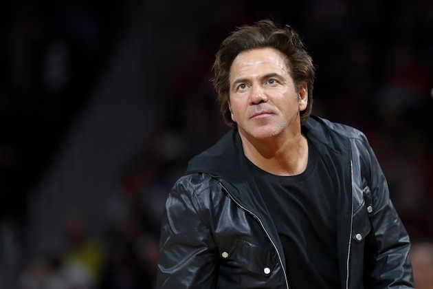 Detroit Pistons owner Tom Gores watches in the second half of an NBA basketball game against the Milwaukee Bucks in Detroit, Tuesday, Jan. 29, 2019. (AP Photo/Paul Sancya)