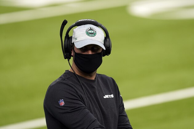 New York Jets head coach Adam Gase walks the sideline during the first half of an NFL football game against the Los Angeles Rams Sunday, Dec. 20, 2020, in Inglewood, Calif. (AP Photo/Ashley Landis )