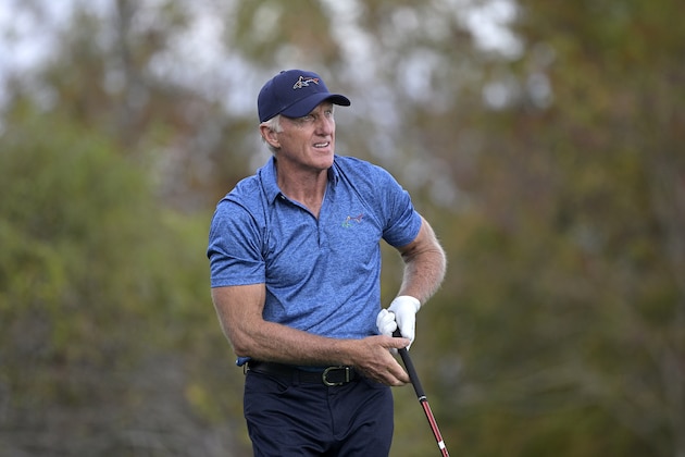 Greg Norman, of Australia, watches his tee shot on the 18th hole during the first round of the PNC Championship golf tournament, Saturday, Dec. 19, 2020, in Orlando, Fla. (AP Photo/Phelan M. Ebenhack)