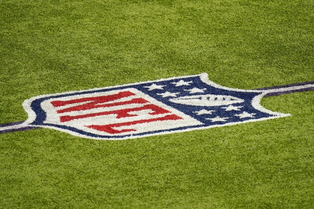 The NFL logo is seen on the field before an NFL football game between the Minnesota Vikings and the Jacksonville Jaguars, Sunday, Dec. 6, 2020, in Minneapolis. (AP Photo/Charlie Neibergall)