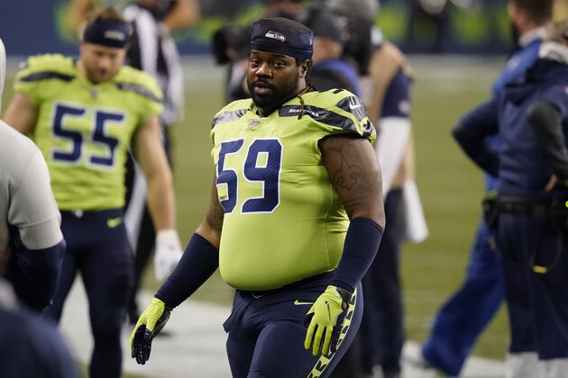 Seattle Seahawks' Damon Harrison stands on the field before an NFL football game against the Arizona Cardinals, Thursday, Nov. 19, 2020, in Seattle. (AP Photo/Elaine Thompson)