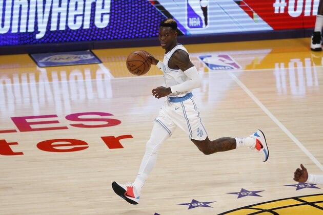 Los Angeles Lakers' Dennis Schroder (17) dribbles against the Dallas Mavericks during the first half of an NBA basketball game Friday, Dec. 25, 2020, in Los Angeles. (AP Photo/Ringo H.W. Chiu)