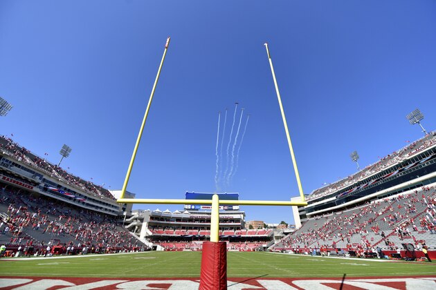 The Hog Formation Flight Team performs a flyover at Donald W. Reynolds Razorback Stadium before the start of Arkansas game against Georgia during an NCAA college football game in Fayetteville, Ark. Saturday, Sept. 26, 2020. (AP Photo/Michael Woods)