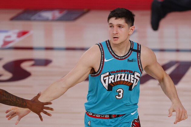 Memphis Grizzlies' Grayson Allen reacts after scoring a three-point basket during the second quarter of an NBA basketball game against the Toronto Raptors, Sunday, Aug. 9, 2020, in Lake Buena Vista, Fla. (Kevin C. Cox/Pool Photo via AP)