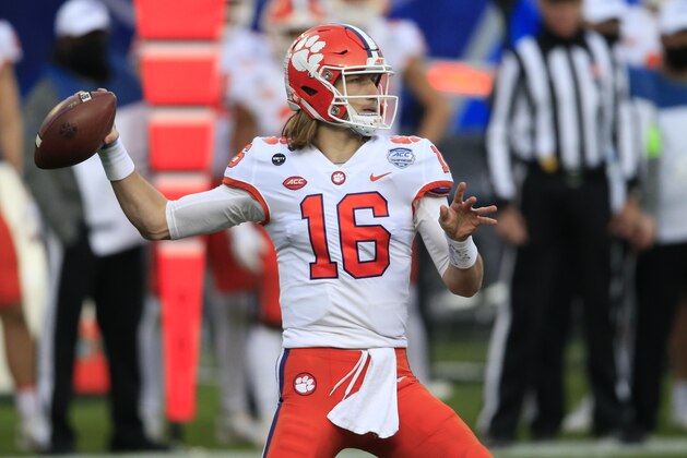 FILE - In this Saturday, Dec. 19, 2020, file photo, Clemson quarterback Trevor Lawrence (16) looks for a receiver during the first half of the Atlantic Coast Conference championship NCAA college football game against Notre Dame in Charlotte, N.C. (AP Photo/Brian Blanco, File)