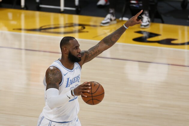 Los Angeles Lakers' LeBron James (23) dribbles against the Dallas Mavericks during the second half of an NBA basketball game Friday, Dec. 25, 2020, in Los Angeles. The Los Angeles Lakers won 138-115. (AP Photo/Ringo H.W. Chiu)