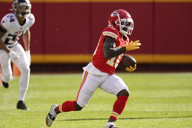 Kansas City Chiefs wide receiver Tyreek Hill runs up field during the first half of an NFL football game against the Atlanta Falcons, Sunday, Dec. 27, 2020, in Kansas City. (AP Photo/Charlie Riedel)