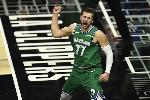 Dallas Mavericks guard Luka Doncic celebrates after scoring and drawing a foul during the first half of an NBA basketball game against the Los Angeles Clippers in Los Angeles Sunday, Dec. 27, 2020. (AP Photo/Kyusung Gong)