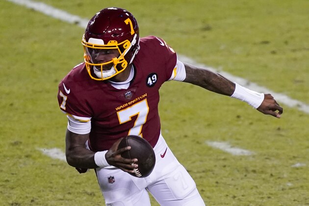Washington Football Team quarterback Dwayne Haskins (7) runs with the ball during the first half of an NFL football game against the Carolina Panthers, Sunday, Dec. 27, 2020, in Landover, Md. (AP Photo/Mark Tenally)