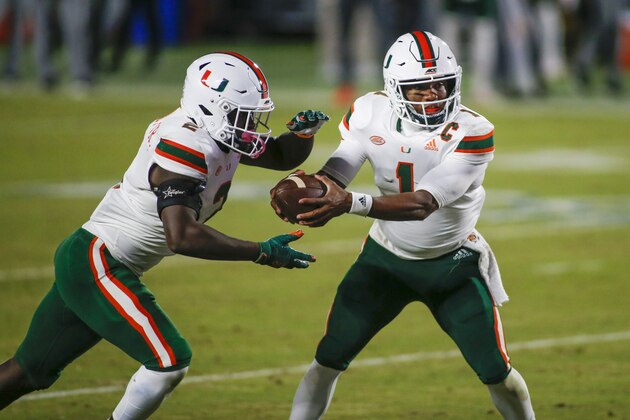 Miami quarterback D'Eriq King (1) hands off to running back Donald Chaney Jr. during the second quarter of the team's NCAA college football game against Duke on Saturday, Dec. 5, 2020, in Durham, N.C. (Nell Redmond/Pool Photo via AP)