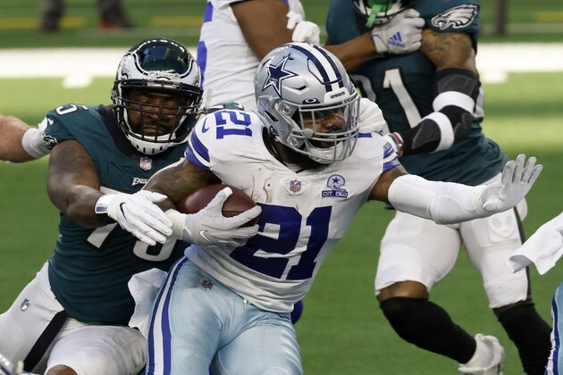 Philadelphia Eagles defensive end Vinny Curry (75) reaches out to stop Dallas Cowboys running back Ezekiel Elliott (21) in the first half of an NFL football game in Arlington, Texas, Sunday, Dec. 27. 2020. (AP Photo/Ron Jenkins)