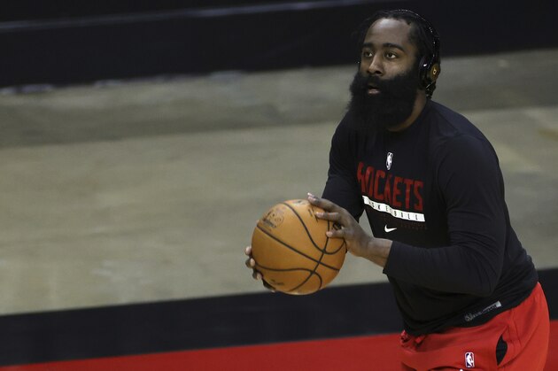Houston Rockets' James Harden warms up prior to facing the San Antonio Spurs in an NBA basketball game in Houston, Thursday, Dec. 17, 2020. (Carmen Mandato/Pool Photo via AP)
