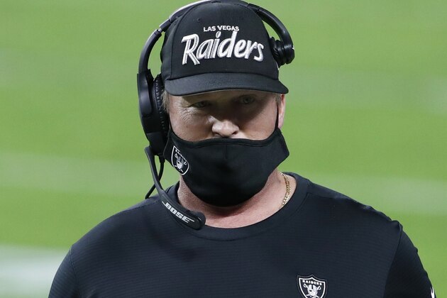 Las Vegas Raiders head coach Jon Gruden stands on the sidelines during the first half of an NFL football game against the Miami Dolphins, Saturday, Dec. 26, 2020, in Las Vegas. (AP Photo/Steve Marcus)