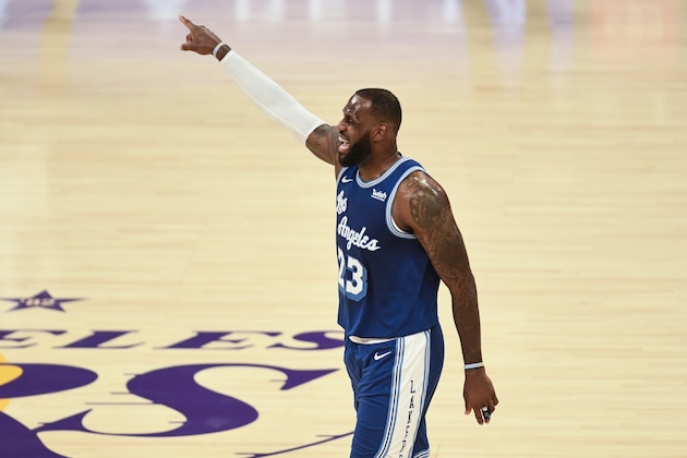 Los Angeles Lakers forward LeBron James yells instructions to his teammates during the first half of an NBA basketball game against the Minnesota Timberwolves in Los Angeles, Sunday, Dec. 27, 2020. (AP Photo/Kyusung Gong)