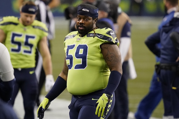 Seattle Seahawks' Damon Harrison stands on the field before an NFL football game against the Arizona Cardinals, Thursday, Nov. 19, 2020, in Seattle. (AP Photo/Elaine Thompson)