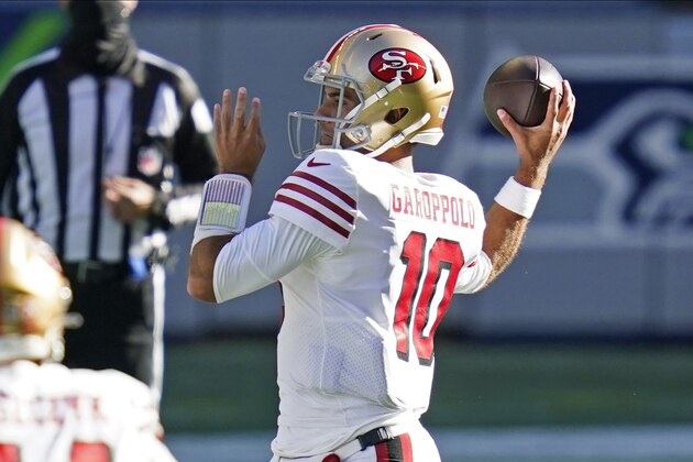San Francisco 49ers quarterback Jimmy Garoppolo passes against the Seattle Seahawks during the first half of an NFL football game, Sunday, Nov. 1, 2020, in Seattle. (AP Photo/Elaine Thompson)