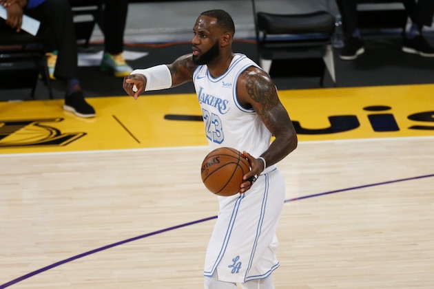 Los Angeles Lakers' LeBron James (23) dribble the ball against the Dallas Mavericks during the first half of an NBA basketball game Friday, Dec. 25, 2020, in Los Angeles. (AP Photo/Ringo H.W. Chiu)