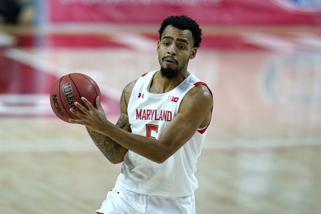 Maryland guard Eric Ayala works the floor against Rutgers during the second half of an NCAA college basketball game, Monday, Dec. 14, 2020, in College Park, Md. Rutgers won 74-60. (AP Photo/Julio Cortez)