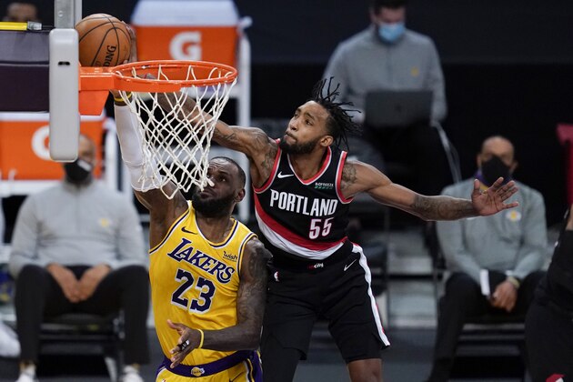 Portland Trail Blazers forward Derrick Jones Jr. (55) blocks a shot by Los Angeles Lakers forward LeBron James (23) during the third quarter of an NBA basketball game Monday, Dec. 28, 2020, in Los Angeles. (AP Photo/Ashley Landis)