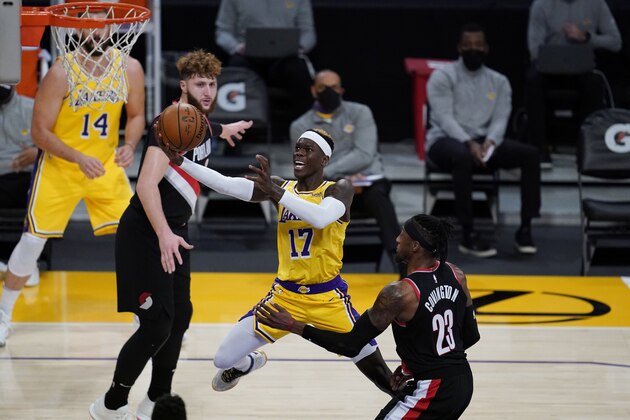 Los Angeles Lakers guard Dennis Schroeder (17) goes up for a shot against Portland Trail Blazers forward Robert Covington (23) during the third quarter of an NBA basketball game Monday, Dec. 28, 2020, in Los Angeles. (AP Photo/Ashley Landis)